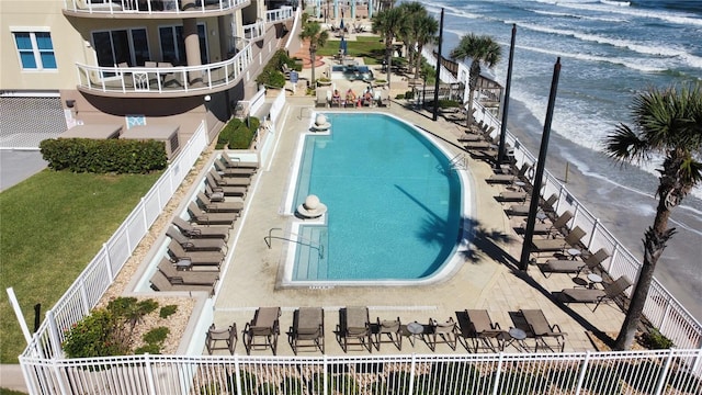 1925 S Atlantic Ave Unit 411, Daytona Beach, FL 32118 - community pool with a water view and a lawn