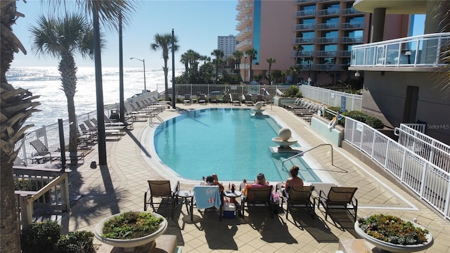 1925 S Atlantic Ave Unit 411, Daytona Beach, FL 32118 - community pool featuring view of water and beach and a patio