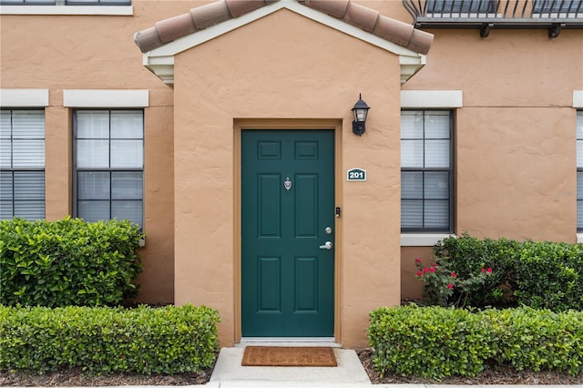 730 Siena Palm Dr Unit 201, Celebration, FL 34747 - view of exterior entry with stucco siding