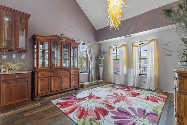 730 Siena Palm Dr Unit 201, Celebration, FL 34747 - entrance foyer with a chandelier, dark wood finished floors, lofted ceiling, and healthy amount of natural light