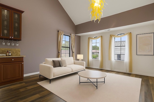 730 Siena Palm Dr Unit 201, Celebration, FL 34747 - living area featuring lofted ceiling, dark wood-style flooring, and a chandelier