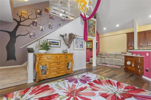 730 Siena Palm Dr Unit 201, Celebration, FL 34747 - living area with stairway, wood finished floors, recessed lighting, baseboards, and high vaulted ceiling