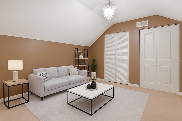 730 Siena Palm Dr Unit 201, Celebration, FL 34747 - living area featuring lofted ceiling, light carpet, and a chandelier