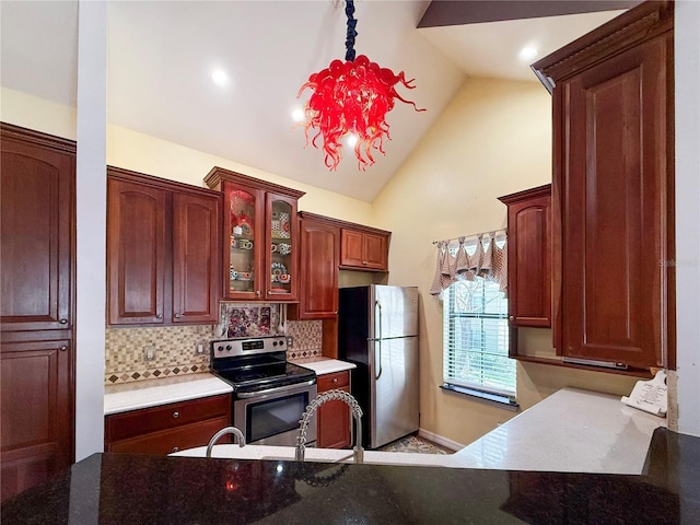 730 Siena Palm Dr Unit 201, Celebration, FL 34747 - kitchen featuring stainless steel appliances, backsplash, glass insert cabinets, and high vaulted ceiling