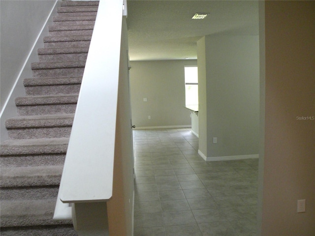 17305 Cagan Crossings Blvd, Clermont, FL 34714 - stairs featuring tile patterned floors and baseboards