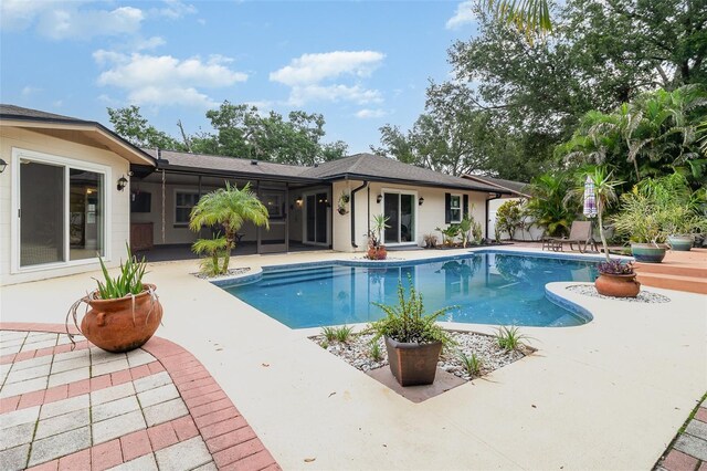7058 Archwood Dr, Orlando, FL 32819 - outdoor pool with a patio area