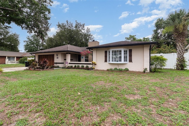 7058 Archwood Dr, Orlando, FL 32819 - ranch-style home with a chimney, stucco siding, concrete driveway, and an attached garage