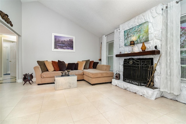 7058 Archwood Dr, Orlando, FL 32819 - living room featuring lofted ceiling, a fireplace, tile patterned flooring, and a textured ceiling