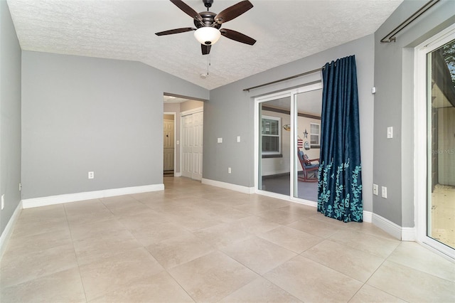 7058 Archwood Dr, Orlando, FL 32819 - unfurnished room featuring a textured ceiling, a ceiling fan, lofted ceiling, baseboards, and light tile patterned floors
