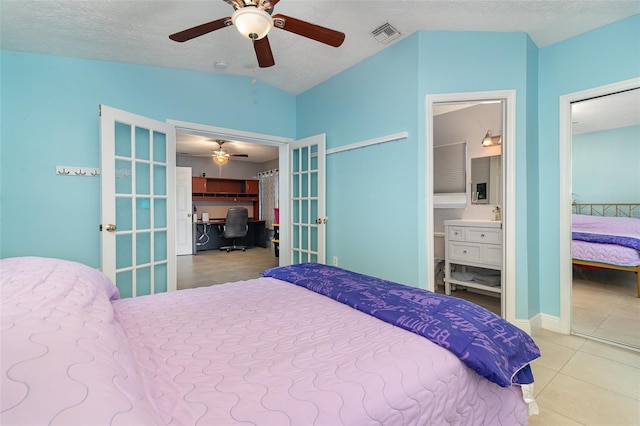 7058 Archwood Dr, Orlando, FL 32819 - bedroom featuring french doors, an office area, tile patterned flooring, vaulted ceiling, and ceiling fan