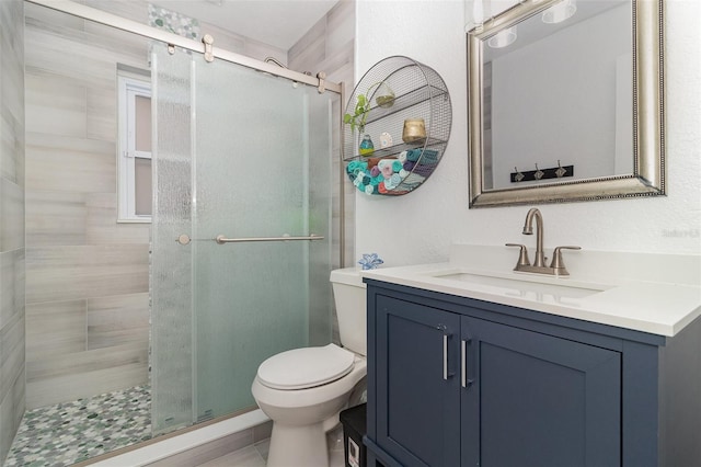 7058 Archwood Dr, Orlando, FL 32819 - bathroom featuring vanity, a shower stall, and toilet