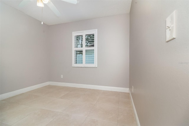 7058 Archwood Dr, Orlando, FL 32819 - empty room featuring a ceiling fan, light tile patterned floors, and baseboards