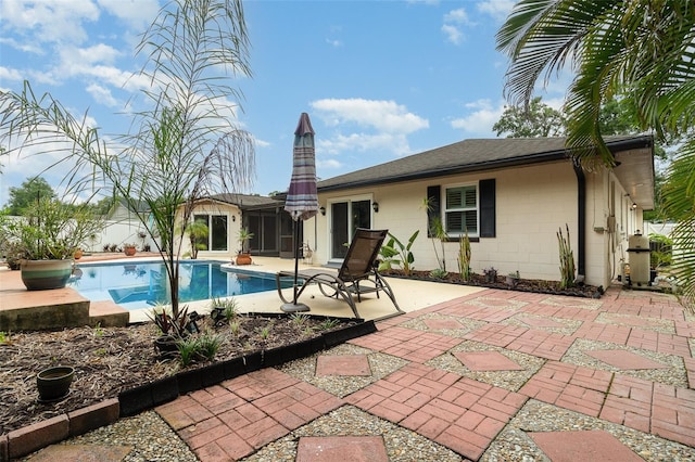 7058 Archwood Dr, Orlando, FL 32819 - view of swimming pool featuring a patio