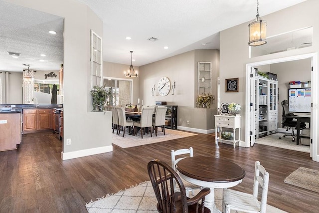 610 Strihal Loop, Oakland, FL 34787 - dining area featuring a chandelier, dark wood finished floors, baseboards, recessed lighting, and a desk