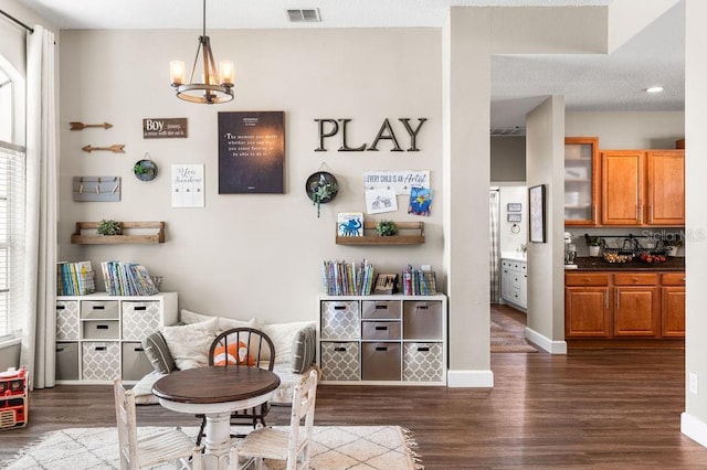 610 Strihal Loop, Oakland, FL 34787 - living area featuring dark wood finished floors, a chandelier, baseboards, and recessed lighting