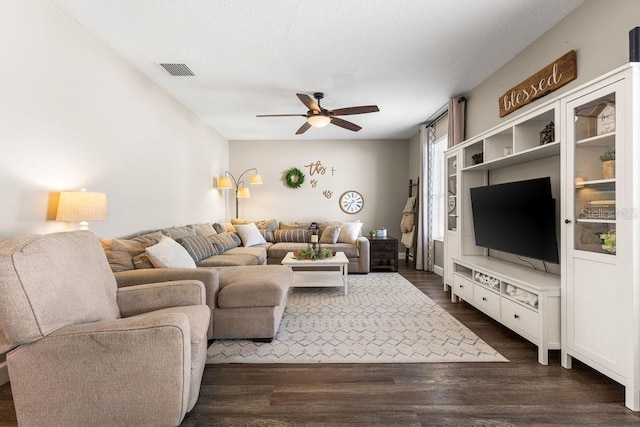 610 Strihal Loop, Oakland, FL 34787 - living room featuring ceiling fan and dark wood-style flooring