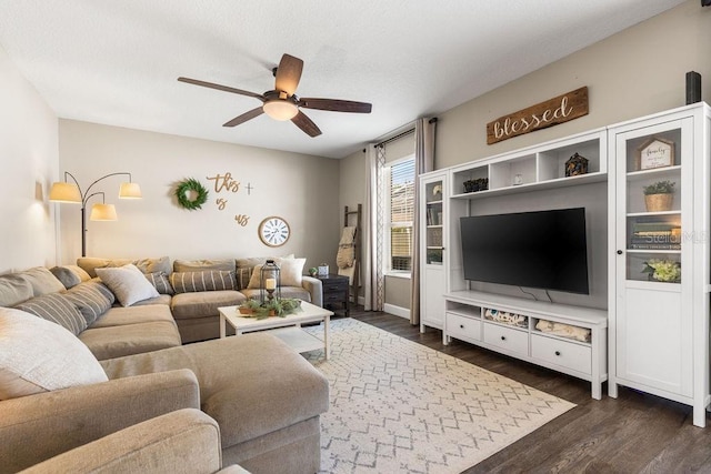 610 Strihal Loop, Oakland, FL 34787 - living area featuring a ceiling fan and dark wood finished floors