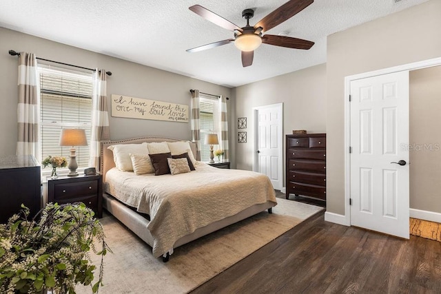 610 Strihal Loop, Oakland, FL 34787 - bedroom with wood finished floors, baseboards, ceiling fan, and a textured ceiling