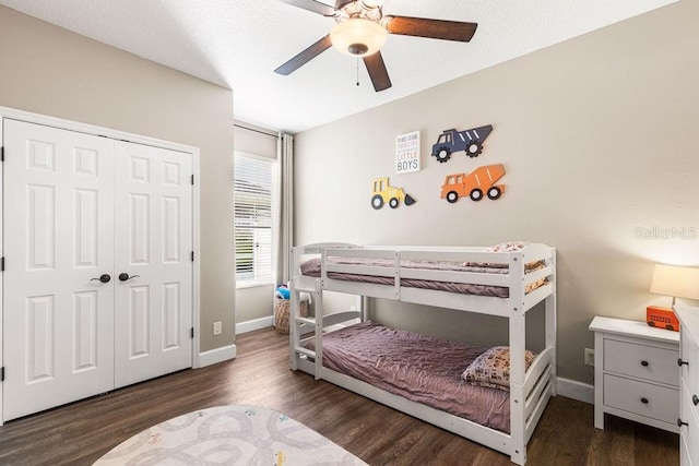 610 Strihal Loop, Oakland, FL 34787 - bedroom featuring wood finished floors, baseboards, a closet, and a ceiling fan