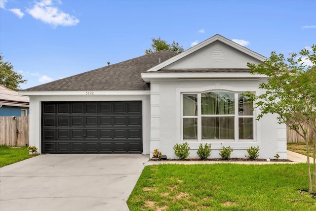 3622 Huntwicke Blvd, Davenport, FL 33837 - ranch-style home featuring stucco siding, roof with shingles, a garage, and concrete driveway