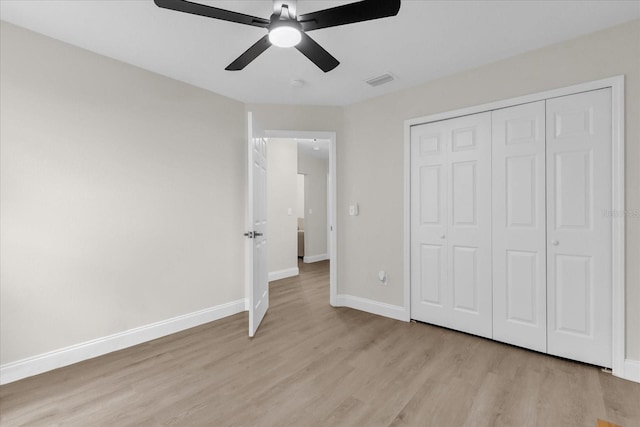 3622 Huntwicke Blvd, Davenport, FL 33837 - unfurnished bedroom with light wood-style floors, baseboards, a closet, and ceiling fan