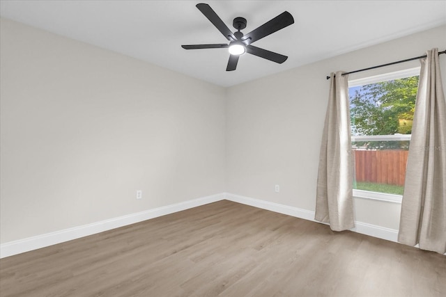 3622 Huntwicke Blvd, Davenport, FL 33837 - unfurnished room with wood finished floors, baseboards, and ceiling fan
