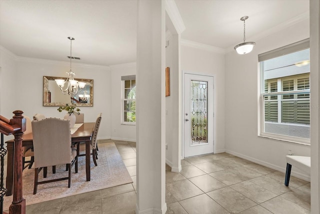 1613 Water Elm Ct, Orlando, FL 32825 - dining area with a chandelier, ornamental molding, baseboards, and light tile patterned floors