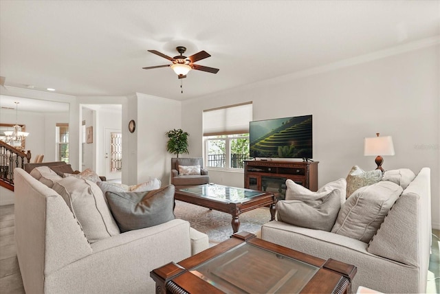 1613 Water Elm Ct, Orlando, FL 32825 - living room featuring a chandelier, ceiling fan, and wood finished floors