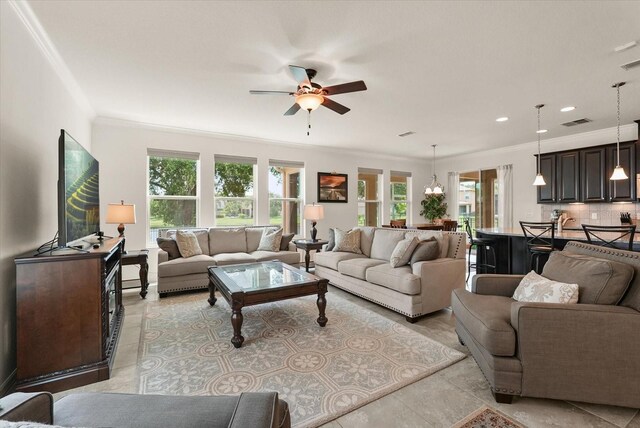1613 Water Elm Ct, Orlando, FL 32825 - living room with ornamental molding, ceiling fan, and recessed lighting