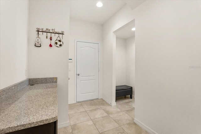 1613 Water Elm Ct, Orlando, FL 32825 - corridor with recessed lighting, baseboards, and light tile patterned flooring