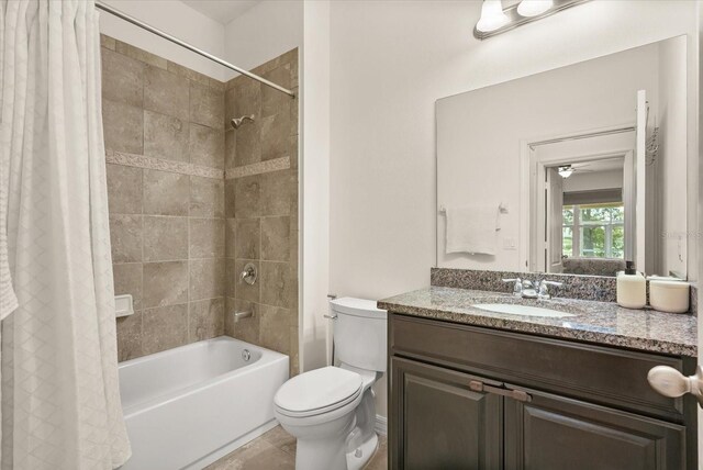 1613 Water Elm Ct, Orlando, FL 32825 - full bathroom featuring shower / bath combo with shower curtain, vanity, and toilet