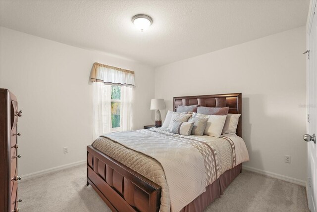 1613 Water Elm Ct, Orlando, FL 32825 - bedroom featuring light colored carpet and baseboards