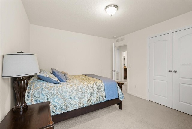 1613 Water Elm Ct, Orlando, FL 32825 - bedroom featuring carpet and a closet