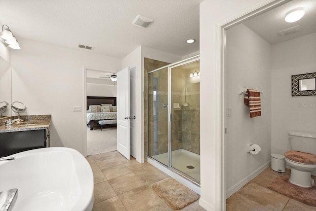 1613 Water Elm Ct, Orlando, FL 32825 - ensuite bathroom with a freestanding bath, a stall shower, ceiling fan, vanity, and baseboards