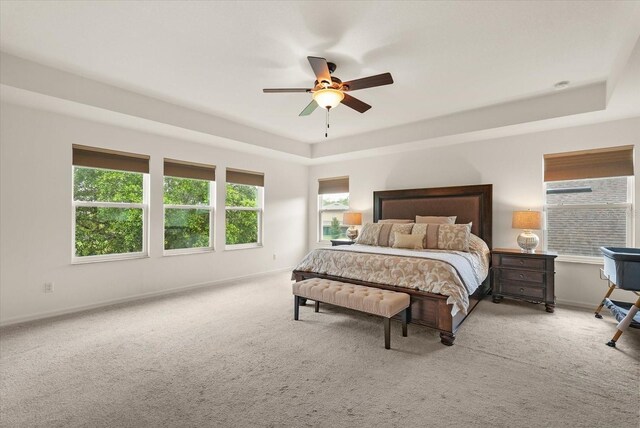 1613 Water Elm Ct, Orlando, FL 32825 - carpeted bedroom with a raised ceiling, baseboards, and a ceiling fan