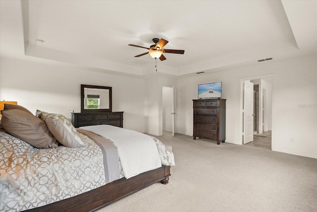 1613 Water Elm Ct, Orlando, FL 32825 - bedroom featuring a raised ceiling, light carpet, a ceiling fan, and baseboards