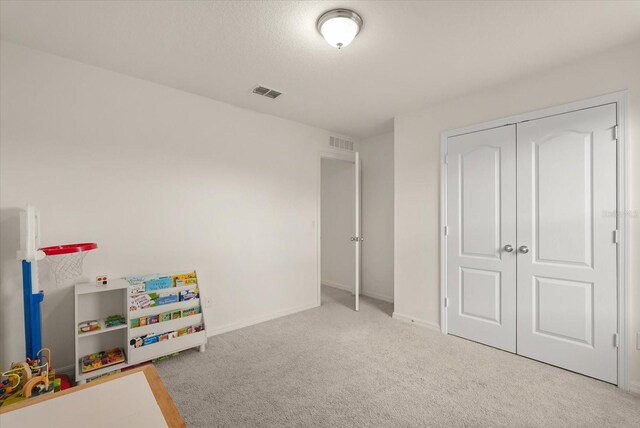 1613 Water Elm Ct, Orlando, FL 32825 - playroom with carpet floors and baseboards