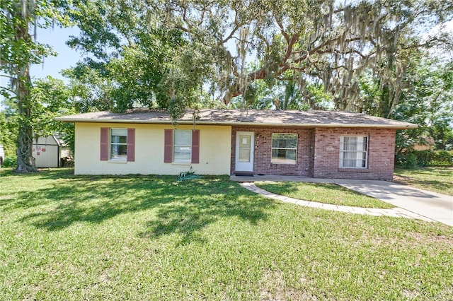 881 Cedar Cir, Tavares, FL 32778 - ranch-style home with a front yard, concrete block siding, and brick siding