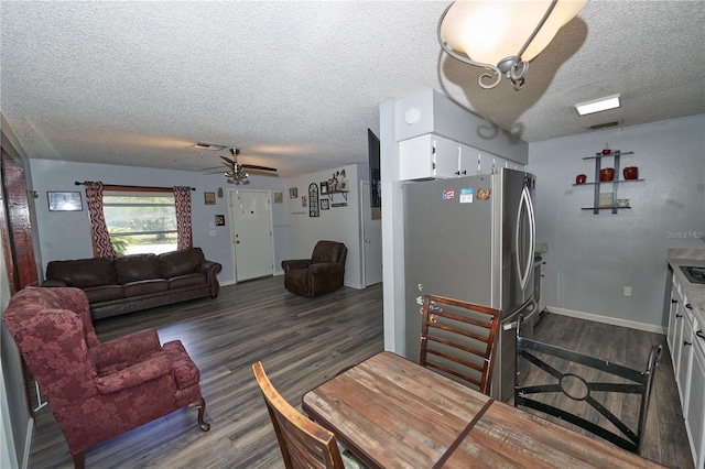 881 Cedar Cir, Tavares, FL 32778 - living room featuring wood finished floors, a textured ceiling, a ceiling fan, and baseboards