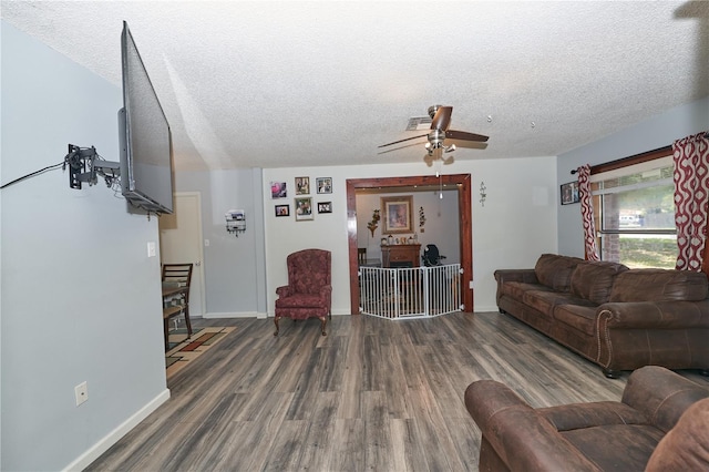 881 Cedar Cir, Tavares, FL 32778 - living area with wood finished floors, a textured ceiling, ceiling fan, and baseboards