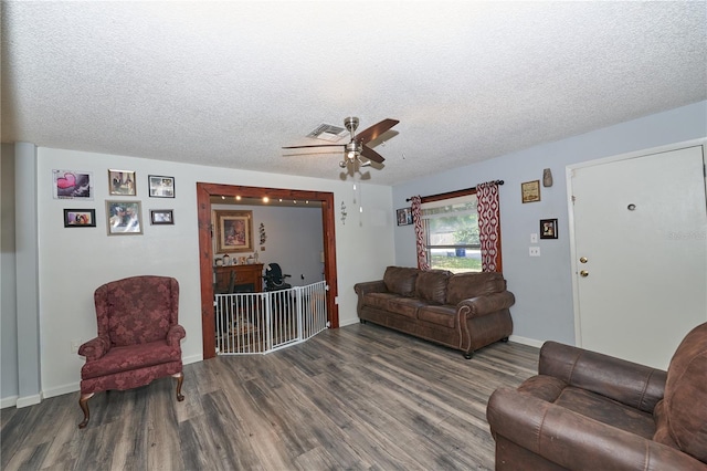 881 Cedar Cir, Tavares, FL 32778 - living room with wood finished floors, ceiling fan, a textured ceiling, and baseboards