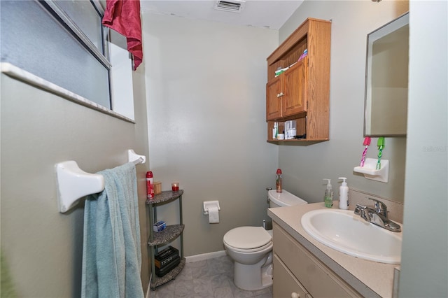 881 Cedar Cir, Tavares, FL 32778 - bathroom with vanity, toilet, tile patterned flooring, and baseboards