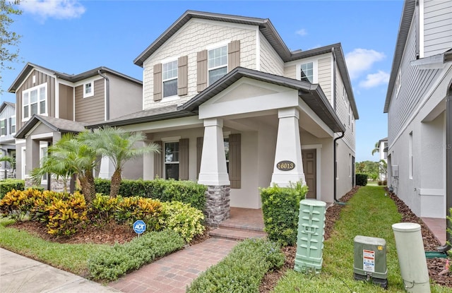 16013 Tollington Aly, Winter Garden, FL 34787 - view of front of home with covered porch and stucco siding
