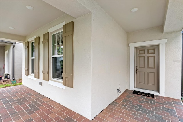 16013 Tollington Aly, Winter Garden, FL 34787 - entrance to property with stucco siding and covered porch