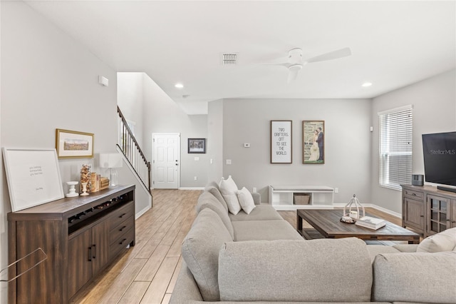16013 Tollington Aly, Winter Garden, FL 34787 - living area with stairs, light wood-style floors, baseboards, recessed lighting, and ceiling fan