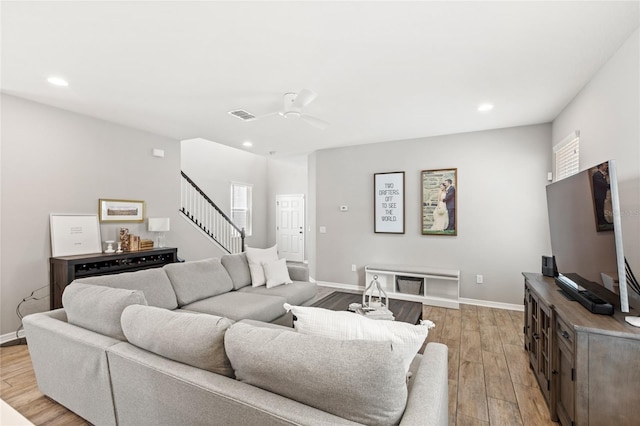 16013 Tollington Aly, Winter Garden, FL 34787 - living area with light wood-type flooring, recessed lighting, stairs, baseboards, and ceiling fan