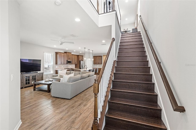 16013 Tollington Aly, Winter Garden, FL 34787 - stairway featuring recessed lighting, wood finished floors, and ceiling fan