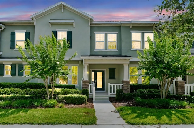 15477 Blackbead St, Winter Garden, FL 34787 - view of property with stucco siding and a porch