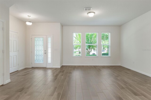 15477 Blackbead St, Winter Garden, FL 34787 - entrance foyer featuring wood finished floors and baseboards