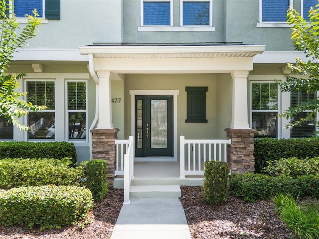 15477 Blackbead St, Winter Garden, FL 34787 - property entrance featuring stucco siding and covered porch